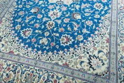 Close-up detail of 2000s Nain rug from Iran / Persia showing Wool weave