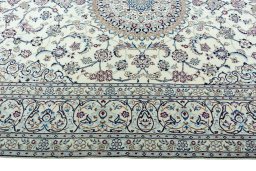 Corner detail of 2000s Nain rug showing border pattern and Wool pile