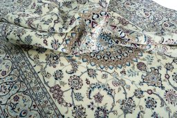 Surface texture of 2000s Nain rug with natural Wool and intricate pattern