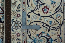 Backside of handmade 2000s Nain rug showing knot structure and weave density
