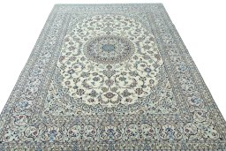 Surface texture of 2000s Nain rug with natural Wool and intricate pattern