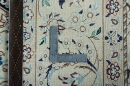 Backside of handmade New Nain rug showing knot structure and weave density