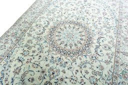Backside of handmade New Nain rug showing knot structure and weave density