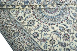 Close-up detail of 2000s Nain rug from Iran / Persia showing Wool weave