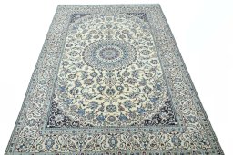Surface texture of 2000s Nain rug with natural Wool and intricate pattern