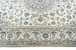 Corner detail of 2000s Nain rug showing border pattern and Wool pile
