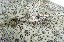 Surface texture of 2000s Nain rug with natural Wool and intricate pattern
