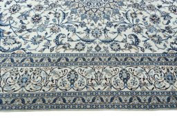 Corner detail of 2000s Nain rug showing border pattern and Wool pile