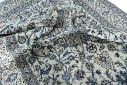 Surface texture of 2000s Nain rug with natural Wool and intricate pattern