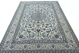 Surface texture of 2000s Nain rug with natural Wool and intricate pattern