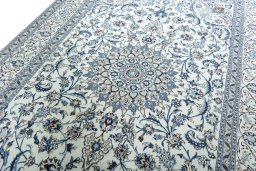 Backside of handmade 2000s Nain rug showing knot structure and weave density