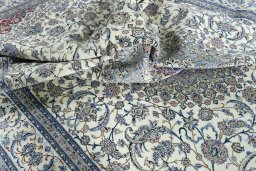Surface texture of 2000s Nain rug with natural Cork and intricate pattern