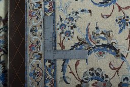 Backside of handmade 2000s Nain rug showing knot structure and weave density