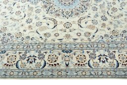 Corner detail of 2000s Nain rug showing border pattern and Wool pile