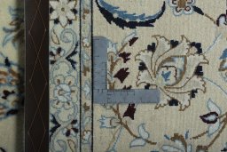Backside of handmade 2000s Nain rug showing knot structure and weave density