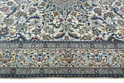Corner detail of 2000s Nain rug showing border pattern and Wool pile