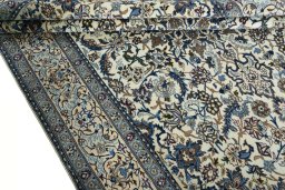 Close-up detail of 2000s Nain rug from Iran / Persia showing Wool weave