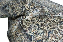 Surface texture of 2000s Nain rug with natural Wool and intricate pattern