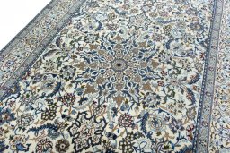 Backside of handmade 2000s Nain rug showing knot structure and weave density