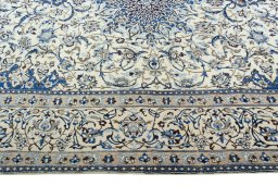 Corner detail of 2000s Nain rug showing border pattern and Wool pile