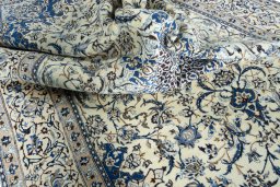 Surface texture of 2000s Nain rug with natural Wool and intricate pattern