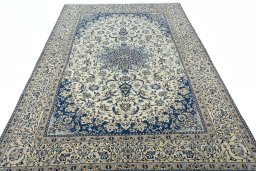 Surface texture of 2000s Nain rug with natural Wool and intricate pattern