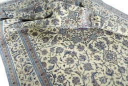 Surface texture of 2000s Nain rug with natural Cork and intricate pattern