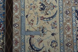 Backside of handmade 2000s Nain rug showing knot structure and weave density