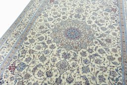 Backside of handmade 2000s Nain rug showing knot structure and weave density