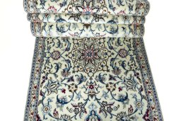 Corner detail of 2000s Nain rug showing border pattern and Wool pile