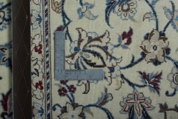 Surface texture of 2000s Nain rug with natural Wool and intricate pattern
