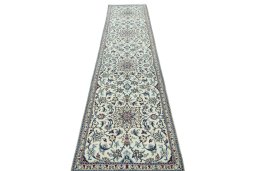 Surface texture of 2000s Nain rug with natural Wool and intricate pattern