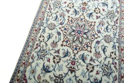 Backside of handmade 2000s Nain rug showing knot structure and weave density