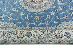Corner detail of 2000s Nain rug showing border pattern and Wool pile