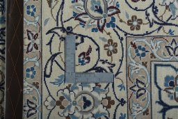 Backside of handmade 2000s Nain rug showing knot structure and weave density
