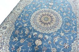 Backside of handmade 2000s Nain rug showing knot structure and weave density