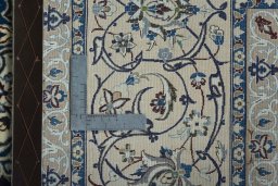Backside of handmade 2000s Nain rug showing knot structure and weave density