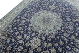 Backside of handmade 2000s Nain rug showing knot structure and weave density