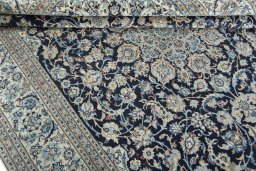 Close-up detail of 2000s Nain rug from Iran / Persia showing Wool weave
