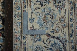 Backside of handmade 2000s Nain rug showing knot structure and weave density