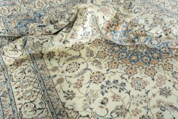 Surface texture of 2000s Nain rug with natural Wool and intricate pattern