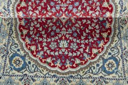 Corner detail of 2000s Nain rug showing border pattern and Wool pile