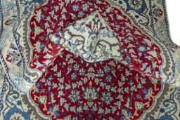 Close-up detail of 2000s Nain rug from Iran / Persia showing Wool weave