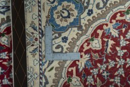 Surface texture of 2000s Nain rug with natural Wool and intricate pattern