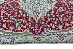 Full view of 2000s Nain rug from Iran / Persia, 132 × 86 cm in Red tones