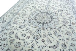 Backside of handmade New Nain rug showing knot structure and weave density