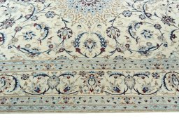 Corner detail of 2000s Nain rug showing border pattern and Wool pile