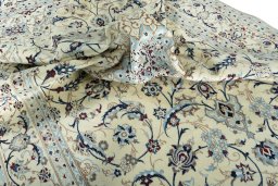 Surface texture of 2000s Nain rug with natural Wool and intricate pattern