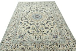 Surface texture of 2000s Nain rug with natural Wool and intricate pattern