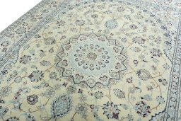 Backside of handmade New Nain rug showing knot structure and weave density